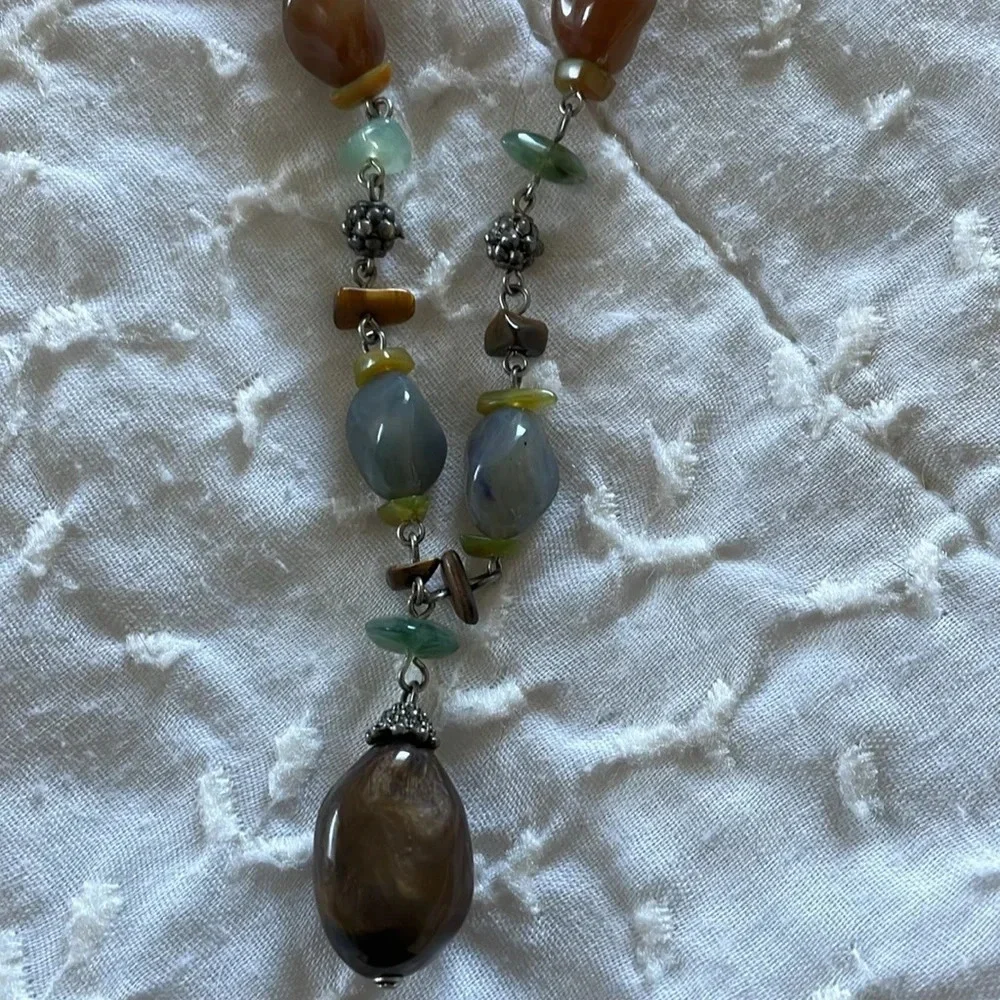 Beautiful necklace. Gray, brown and light aqua stones with silver tone accents.